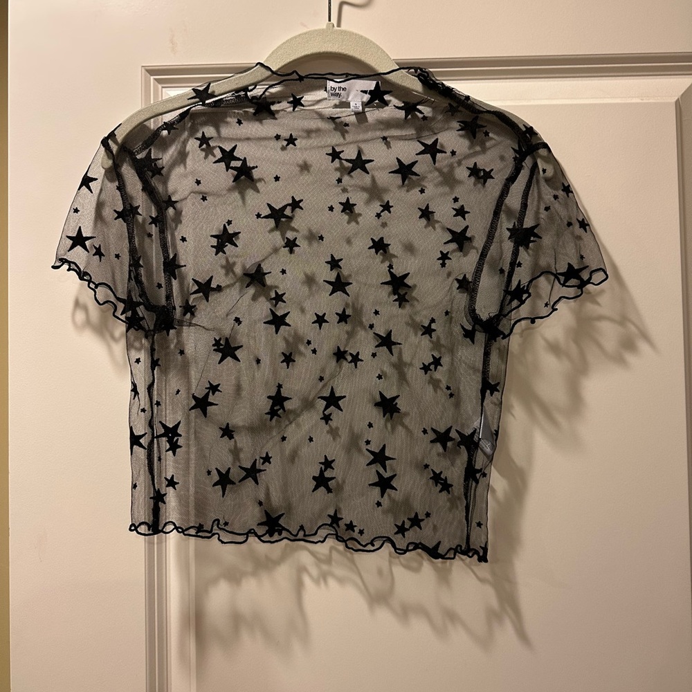 Sheer black top with stars
